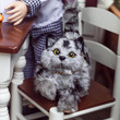 In 18 inch doll kitchen the grey striped kitty cat 18 inch doll accessory sits on the table chair.