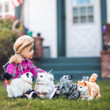 In outdoor scene, an 18 inch doll sits with the 4 18 inch doll cat pets. In outdoor scene, an 18 inch doll sits with the 4 18 inch doll cat pets.