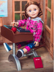 In school room scene an 18 inch doll sits at the school desk with the chalkboard, pencil, and apple on top. In school room scene an 18 inch doll sits at the school desk with the chalkboard, pencil, and apple on top.
