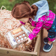 In outdoor scene, an 18 inch doll reaches down for the set contained in it's Farm Fresh labeled crate. In outdoor scene, an 18 inch doll reaches down for the set contained in it's Farm Fresh labeled crate.