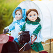 In outdoor scene, our Laura and Mary Ingalls dolls hold Black Susan in their lap riding a horse wagon. In outdoor scene, our Laura and Mary Ingalls dolls hold Black Susan in their lap riding a horse wagon.
