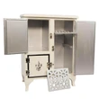 A miniature white wooden 1930s-style vintage icebox cabinet is shown with its doors open against a solid white background. The left upper door and the tall right door are wide open, revealing metallic silver-painted interiors and a removable white geometric grate shelf resting on the floor in front. The small lower left door remains closed, displaying its black painted trim and a decorative fleur-de-lis emblem.