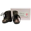 This studio product shot features a pair of realistic miniature lace-up boots sized for 18-inch dolls, isolated on a clean white background.