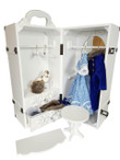 Against white background the 18" doll trunk holds the blue dress and coat on the right side and included accessories in the drawers on left side. Against white background the 18" doll trunk holds the blue dress and coat on the right side and included accessories in the drawers on left side.