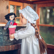 Our Laura Ingalls 18 inch doll, wearing the white eyelet nightgown and matching cap, is hanging her stocking up by the fireplace. Our Laura Ingalls 18 inch doll, wearing the white eyelet nightgown and matching cap, is hanging her stocking up by the fireplace.