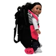 A side-profile view of a doll secured inside a black doll-carrier backpack featuring a pink front pouch and black-and-white striped accents. A rolled-up pink sleeping bag attached beneath the backpack against a plain white background.