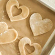 Heart shaped sugar cookies on cookie sheet. Heart shaped sugar cookies on cookie sheet.