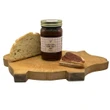 Little House on the Prairie Apple Jam with Bread on  cutting board with a white background.