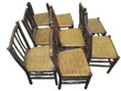 Set of 7 Hickory Dining Chairs facing left on a white background