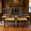 Set of 7 Hickory Dining Chairs inside a rustic room in the Adiriondacks