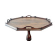 An antique George III style octagonal tripod table crafted from dark mahogany, isolated against a plain white background. The table features an ornate, wavy gallery-top rim with integrated handle cutouts on each side. This image focuses on the top.
