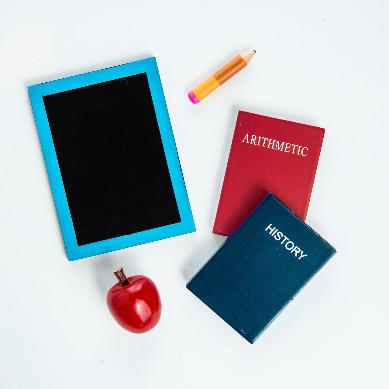The school themed 18" doll accessories include a chalkboard, two textbooks, pencil and apple all made from wood and hand painted.