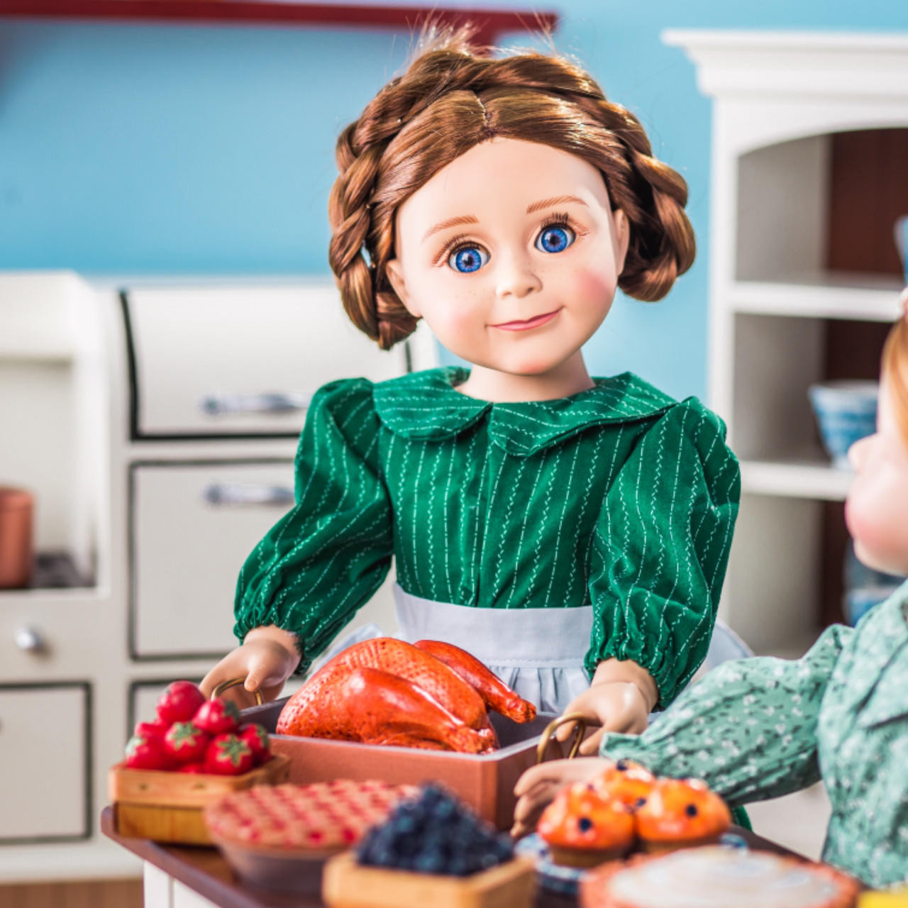 In doll kitchen play scene our Little House on the Prairie Mary Ingalls doll serves the chicken roast to the 18 inch kitchen table.