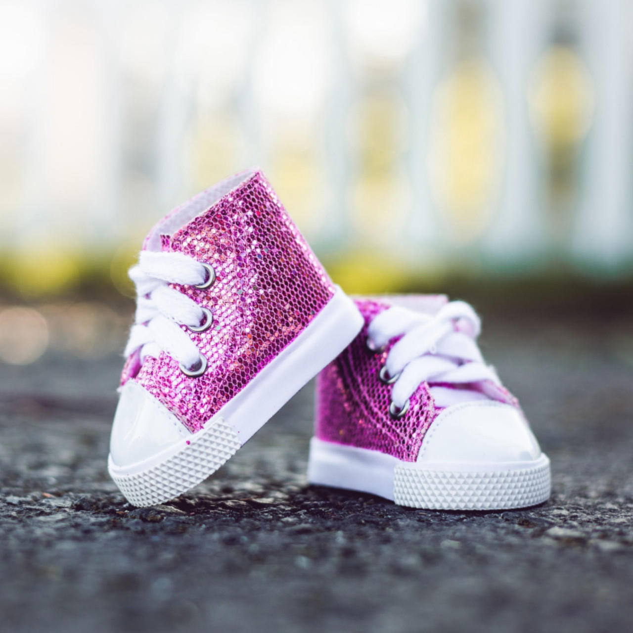https://cdn11.bigcommerce.com/s-m5vcu70215/images/stencil/1280x1280/products/265/2408/the-queens-treasures-set-of-2-pair-of-glitter-sneaker-shoes-for-18-dolls__07497.1692302651.jpg?c=1
