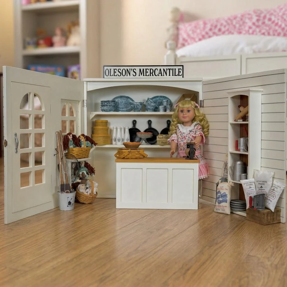 The Queen's Treasures Little House on the Prairie 18 inch Doll Oleson's Mercantile Play Set compatible with American Girl dolls. The 18 inch doll mercantile is inside a childs bedroom.