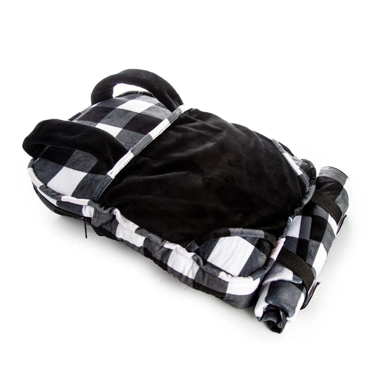 A plush doll-carrier backpack featuring a solid black front panel over a black and white buffalo plaid patterned background, displayed at an angle. Black shoulder straps and a top handle extend from the main bag, while a matching black and white plaid rolled-up sleeping bag is secured underneath against a plain white background.