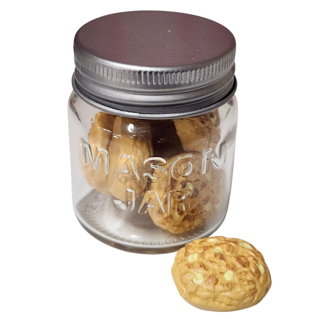close up of 18 inch doll mason jar filled with cookies