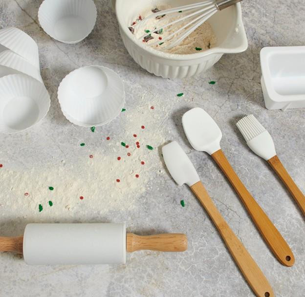 baking tools displayed on a baking board with flour showing