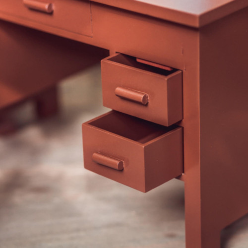 A close-up photograph showcases the detailed functionality of a miniature wooden desk designed for 18-inch dolls.
