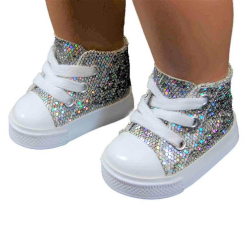 A close-up view shows a doll's feet wearing a pair of high-top sneakers with glittering, silver holographic uppers. The shoes feature thick white laces crisscrossed over the front, smooth white toe caps, and clean white rubber soles, set against a solid white background.