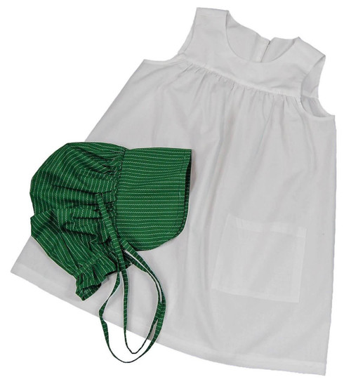 The child size white apron and green bonnet laid out against white backdrop. The child size white apron and green bonnet laid out against white backdrop.