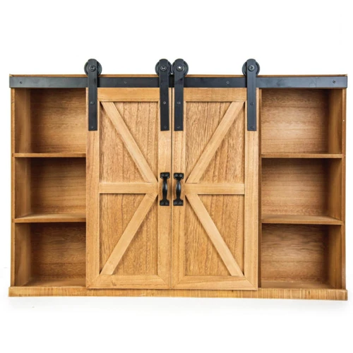 An empty wooden doll storage trunk with the sliding barn doors closed in the center, revealing three open storage shelves on each side.