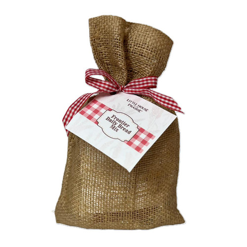 Little House on the Prairie Frontier Daily Bread Mix packaged in burlap bag with gingham ribbon and label. Little House on the Prairie Frontier Daily Bread Mix packaged in burlap bag with gingham ribbon and label.