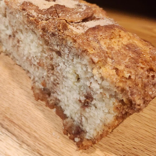 Little House on the Prairie Loaf Cake cut through the center showing cinnamon sugar swirl