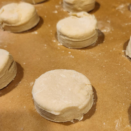 Close up of biscuit dough on parchment paper Close up of biscuit dough on parchment paper