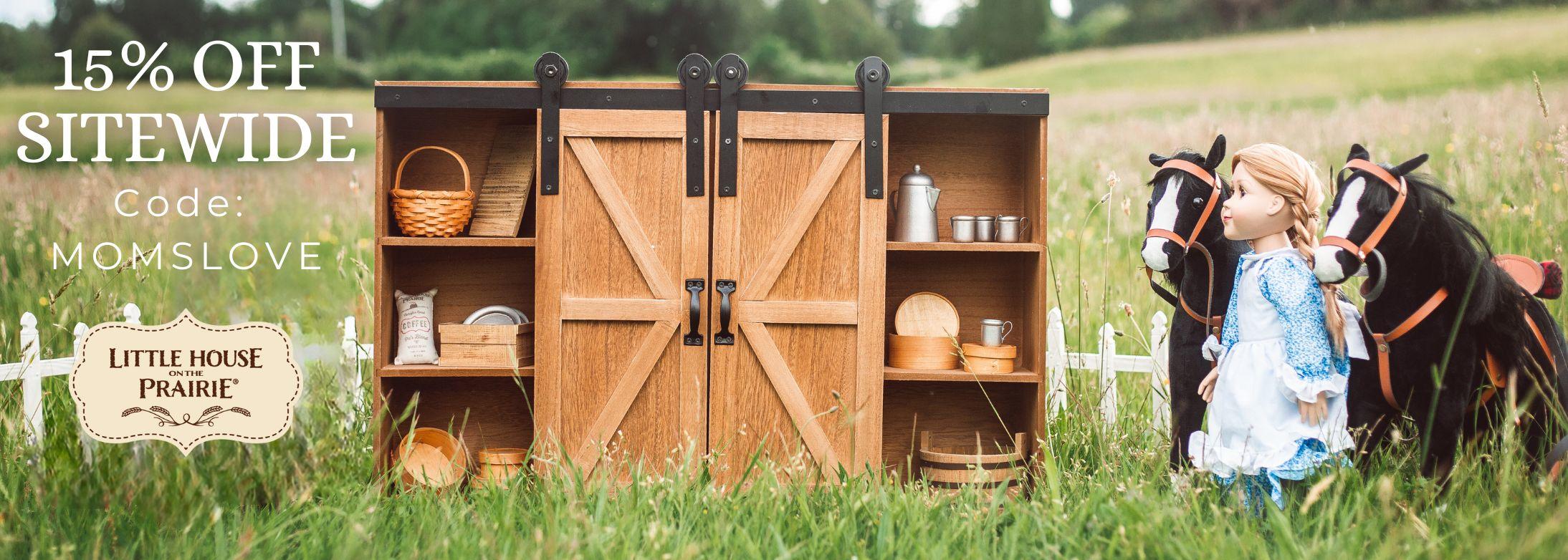 15% Off SITEWIDE Code: MOMSLOVE. Little House on the Prairie logo; Image of the the Little House Clothes Storage Trunk with the Mary ingalls 18 inch Doll to the side 