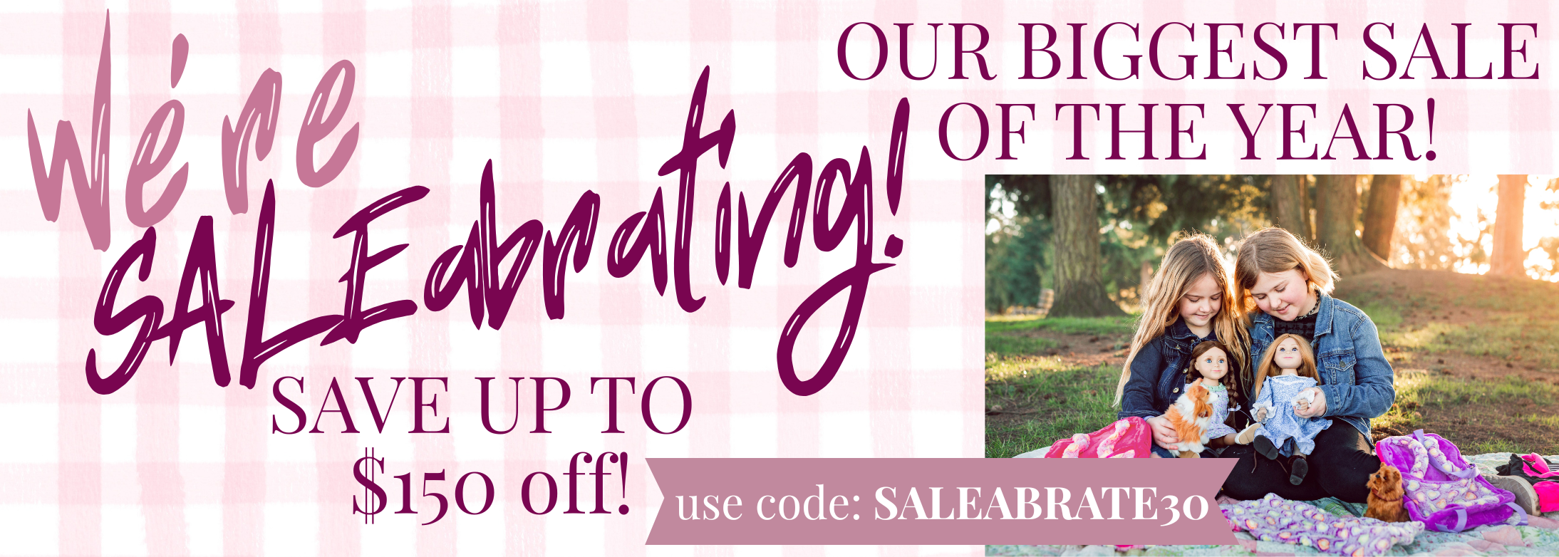 We&#039;re Saleabrating, save up to 150 off. Our biggest sale of the year. picture of two girls holding their dolls on a blanket