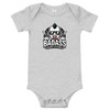 Grey baby bodysuit featuring the "Badass Baby" logo with a cool baby wearing sunglasses, a mohawk, and a skull pacifier, surrounded by lightning bolts and stars.