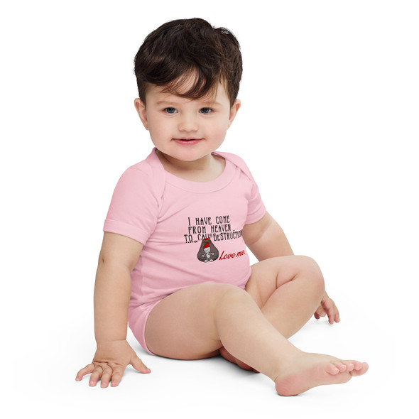 model wearing Baby bodysuit featuring a cute but devilish character and the phrase "I have come from Heaven to cause chaos and destruction, Love me." model wearing Baby bodysuit featuring a cute but devilish character and the phrase "I have come from Heaven to cause chaos and destruction, Love me."
