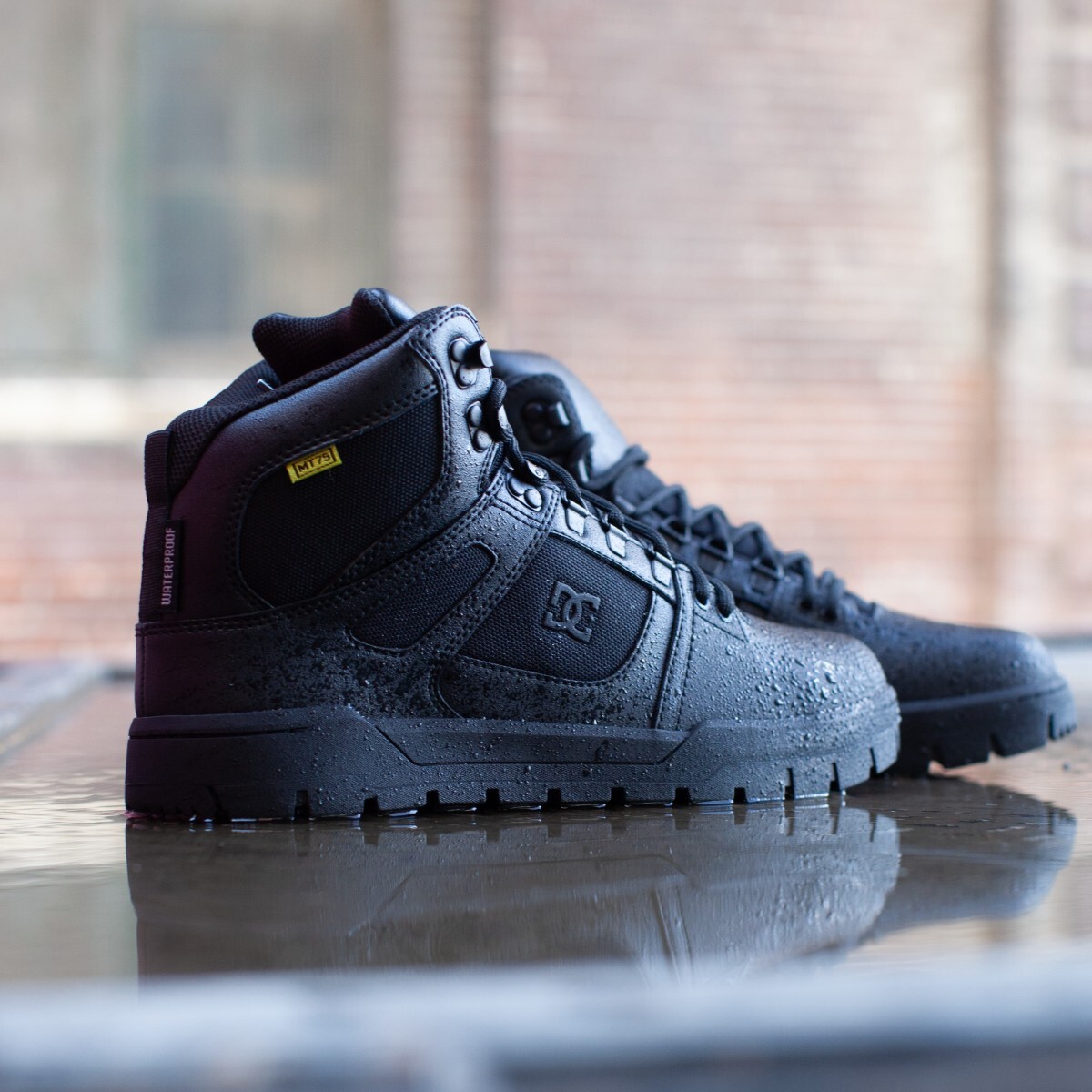 dc60604-dc-img-1861-square.jpg DC60604 waterproof skate shoes sitting in a puddle on a metal surface