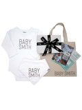 Baby's Year of Firsts Deluxe Gift Voucher - showing the Gift Voucher, Personalised Onesie and Bib, Vouucher Gift Box and Personalised Tote Bag