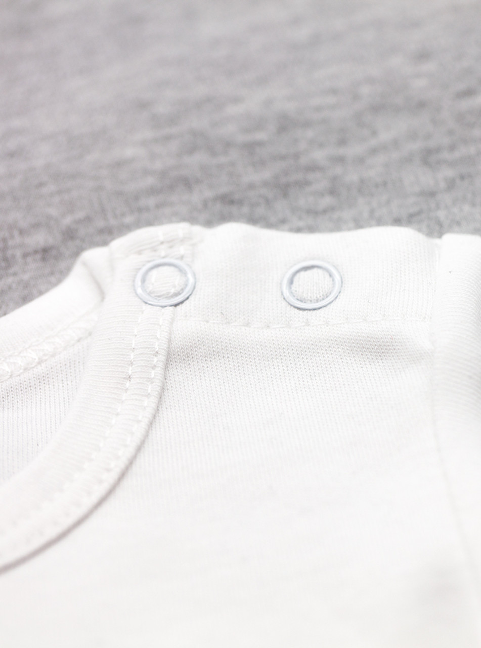 Close up shot of our press studs on a onesie
