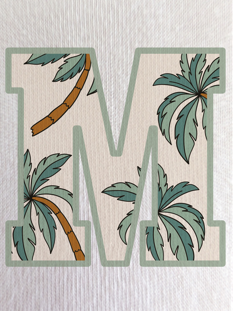 Close-up of the palm print within the ‘M’, showcasing soft earthy tones and fine line detailing