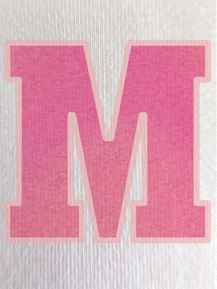 Close-up of the soft gradient print within the ‘M’, showcasing subtle tonal variation and smooth finish