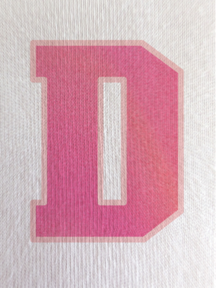 Close-up of the soft gradient print within the ‘D’, showcasing subtle tonal variation and smooth finish