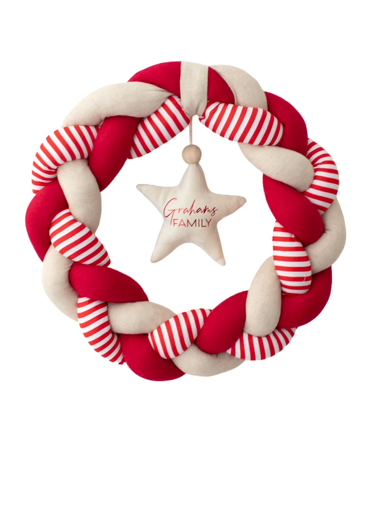 Personalised red Christmas wreath with striped fabric and hanging cream star featuring Grahams Family