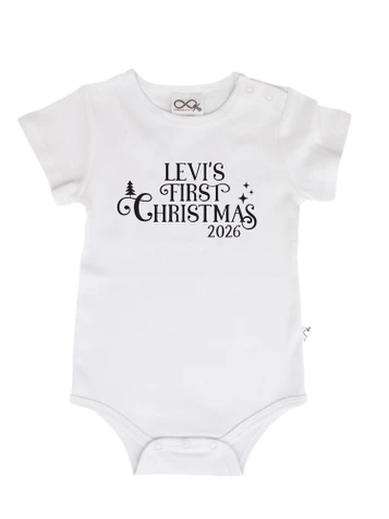 White baby onesie with personalised First Christmas typography design featuring baby's name and year