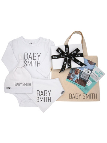 Baby's Year of Firsts Platinum Gift Voucher - showing the Gift Voucher, Personalised Bib, Beanie and Onesie, Voucher Gift Box and Personalised Tote Bag.