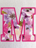 Close-up of our signature soft floral print inside the ‘M’ - showcasing vibrant colours and fine print detail