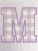 Close-up of the gingham print within the ‘M’, showcasing soft lilac tones and a classic check pattern