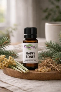 Essential7 Happy Bones essential oil blend in an amber glass bottle with the original Essential7 logo, displayed on a natural wooden tray and surrounded by botanicals that reflect the blend’s ingredients. White Spruce and Balsam Fir branches frame the bottle, while Helichrysum flowers, Lemongrass, Vetiver root, and Copaiba resin create a fresh, earthy presentation. Soft natural lighting, neutral linen, and a gently blurred background give the image a warm, grounded, forest-inspired feel.