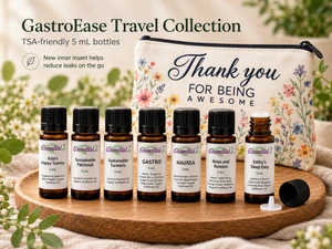 Essential7 GastroEase Travel Collection featuring seven TSA-friendly 5 mL essential oil blends—Kate’s Happy Tummy, Sustainable Patchouli, Sustainable Turmeric, Gastro, Nausea, Relax and Release, and Kathy’s Sleep Easy. Beautifully arranged in front of a reusable floral zippered travel pouch featuring the inspirational message “Thank You for Being Awesome.” The collection includes bottles with inner inserts designed to help reduce leaks while traveling. Presented in a warm botanical setting, perfect for travel wellness, digestive comfort, relaxation, and thoughtful gift-giving.