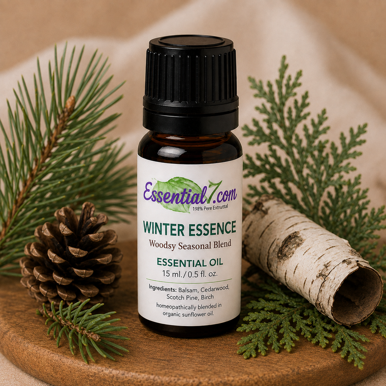 Essential7 Winter Essence essential oil blend with balsam, cedarwood, Scotch pine, and birch in a winter forest setting.