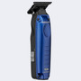 Side view of the BaBylissPRO® LO-PROFX Compact Trimmer, highlighting its ergonomic grip, blue metal housing, and the grey side power switch.