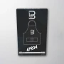 L3VEL3 Professional Barber Apron in Black – water, bleach & dye resistant nylon with hip pockets at Weiss Barber Supply