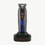 StyleCraft SC423B x 360 Jeezy Professional Trimmer with IN3 Vector Motor, gold X-Pro Wide blade, and blue LED power button on charging base